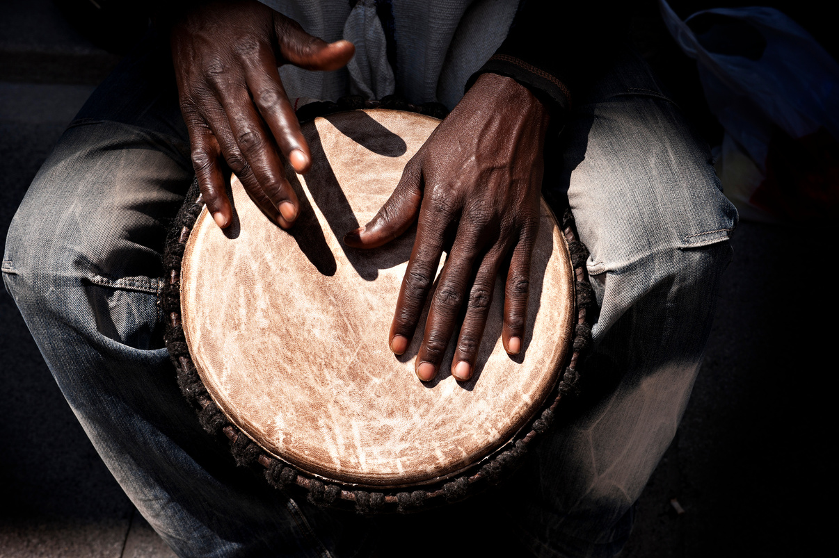 Man drumming on an African drum